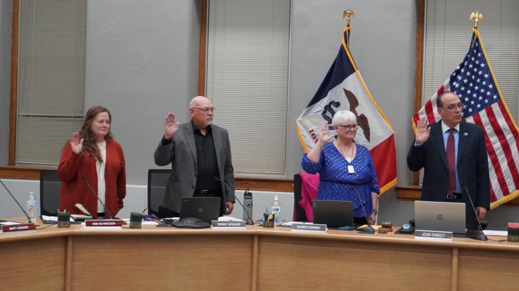 Picture of Muscatine Board of Education Members are sworn in during the meeting on Monday, November 20, 2023. Kim Schneider, Denny Schuur, Karen Cooney, and John Dabeet are Pictured.