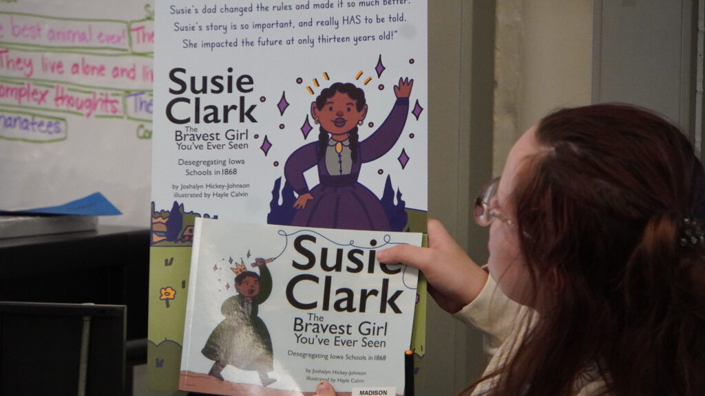 Photo of teacher holder Susie Clark book. 