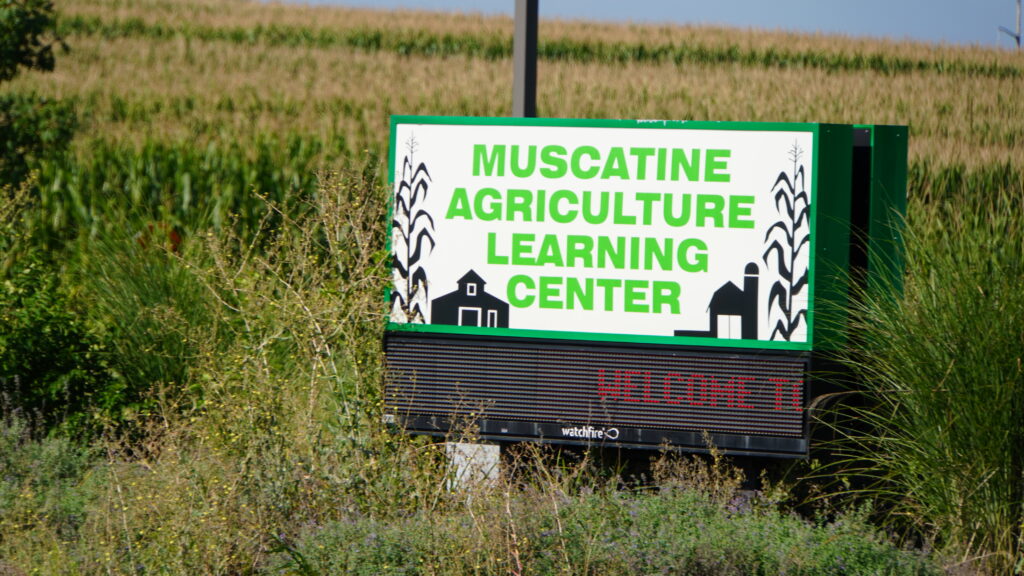 Picture of the sign outside of the muscatine ag learning center that displays the name of the building 