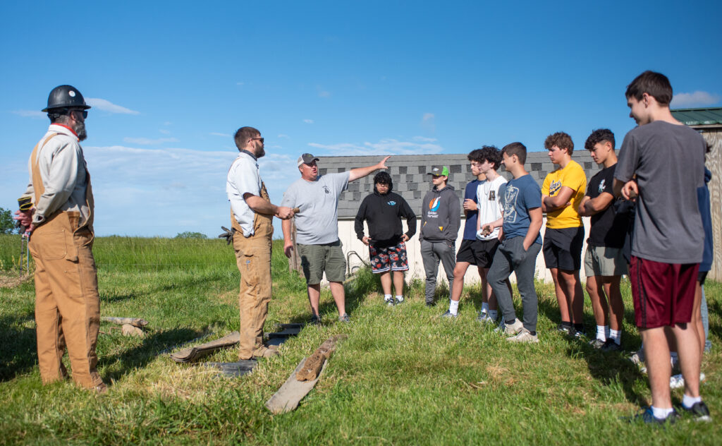 Students and University of Iowa staff photographed at the installation of a weather station. 